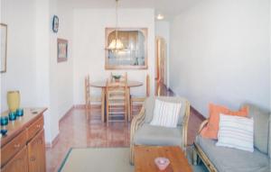 a living room with a couch and a table at 2 Bedroom Cozy Apartment In Torrevieja in Torrevieja