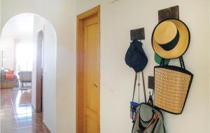 a room with a hat hanging on a wall at 2 Bedroom Cozy Apartment In Torrevieja in Torrevieja