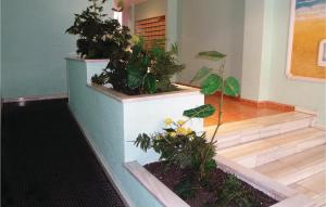 a room with stairs with plants on them at 2 Bedroom Cozy Apartment In Torrevieja in Torrevieja +5 photos