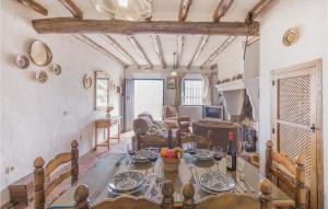 a living room with a dining room table and a living room at Gorgeous Home In Zahara De La Sierra in Zahara de la Sierra