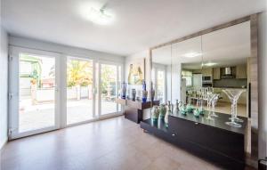 a large living room with a large glass wall at Villa Carolina Peñíscola in Peñíscola