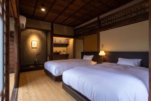 Katil atau katil-katil dalam bilik di NIPPONIA HOTEL Ozu Castle Town