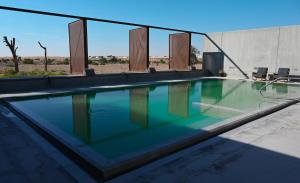 Бассейн в Al Faya Retreat by Sharjah Collection или поблизости