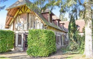 an old house with a tree in front of it at 4 Bedroom Beautiful Home In Bosroumois in Bosnormand