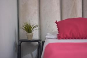 Postel nebo postele na pokoji v ubytování Hostal Casa Estación