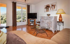 a living room with a tv and a glass table at Nice Home In Casalabriva With 2 Bedrooms And Wifi in Casalabriva