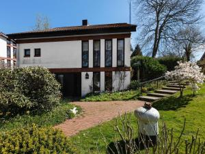 a house with a brick path in front of it at Flat in Meldorf next to the town centre in Meldorf