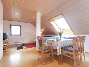 a dining room with a table and chairs at Modern Apartment in Waldachtal near the Forest in Waldachtal