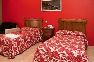 Postel nebo postele na pokoji v ubytování Hotel Rural Miguel Angel