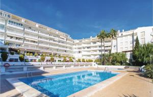a swimming pool in front of a large building at Awesome Apartment In Altea With Wifi in Altea