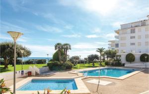 a swimming pool in front of a building at Awesome Apartment In Altea With Wifi in Altea