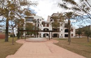 a building with a fountain in the middle of a park at Amazing Apartment In Baños Y Mendigo in Baños y Mendigo