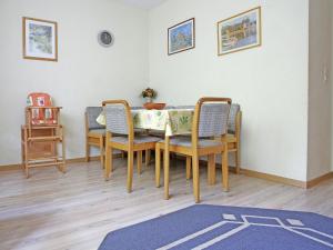 a dining room with a table with chairs and a table at Secluded Apartment in Medebach with Terrace in Medebach