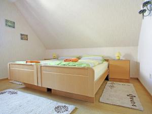 a bedroom with a bed in a attic at Secluded Apartment in Medebach with Terrace in Medebach