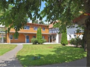 a house with a lawn in front of it at Charmante Wohnung mit eigener Terrasse in Bad Wildungen +32 photos