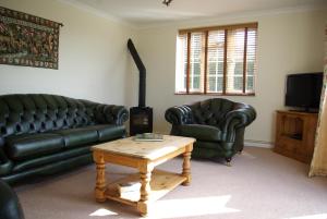 A seating area at Leeds Castle Holiday Cottages
