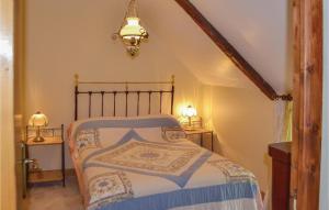 a bedroom with a bed and two night stands at Amazing Home In Guern With Wifi in Guern