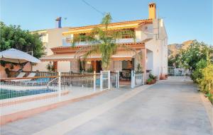 a building with a fence in front of it at 6 Bedroom Beautiful Home In La Azohia in La Azohía +23 photos