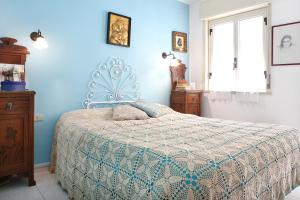 A bed or beds in a room at Splendida Casa A Taormina " Casa di Anna "