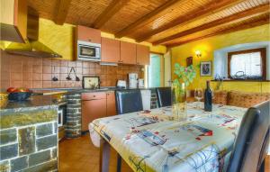 a kitchen with a table with a table cloth on it at 2 Bedroom Stunning Home In Kastel in Kaštel