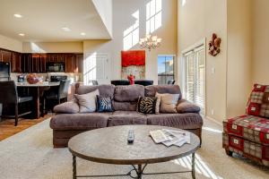 a living room with a couch and a table at Golfer's Paradise in New Braunfels