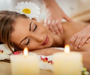 a woman getting a massage in a spa with candles at Carnival View Guest Lodge and spa in Boksburg
