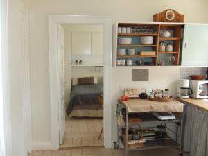 a kitchen with a room with a bed at Nattely I Viborg By in Viborg