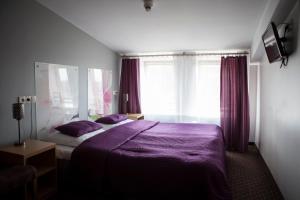 Posteľ alebo postele v izbe v ubytovaní Hotel Secesja