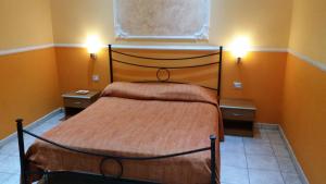 A bed or beds in a room at Hotel Gorizia