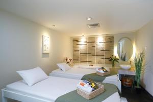 Postel nebo postele na pokoji v ubytování Cityloog Hotel Tebet Jakarta + 20 fotografií