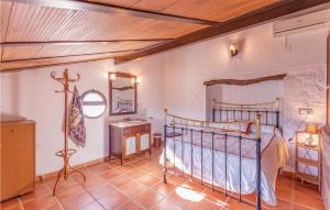 A bed or beds in a room at 8 Bedroom Lovely Home In Iznájar