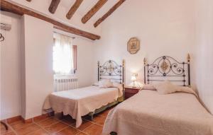 A bed or beds in a room at 8 Bedroom Lovely Home In Iznájar