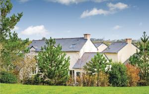 a large white house with trees in front of it at Le Hameau De Peemor Pen in Morgat