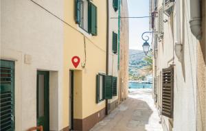 a street in positano with a red marker on a building at Awesome Home In Pag With Wifi in Pag