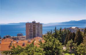 a view of a city with the ocean and buildings at Stunning Apartment In Rijeka With 1 Bedrooms And Wifi in Rijeka