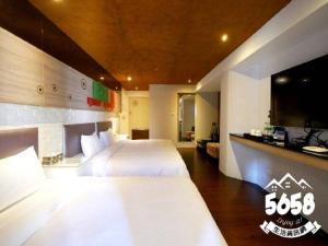Postel nebo postele na pokoji v ubytování R8 Eco Hotel