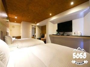 Postel nebo postele na pokoji v ubytování R8 Eco Hotel