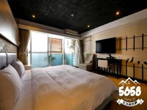 Postel nebo postele na pokoji v ubytování R8 Eco Hotel