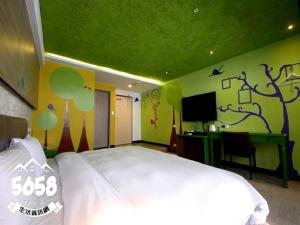 Postel nebo postele na pokoji v ubytování R8 Eco Hotel