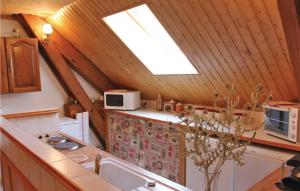 a kitchen with a sink and a skylight at Gîte Du Jocou in Glandage +8 photos