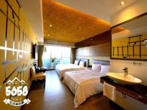 Postel nebo postele na pokoji v ubytování R8 Eco Hotel
