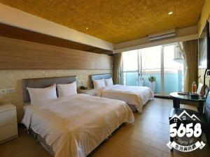 Postel nebo postele na pokoji v ubytování R8 Eco Hotel