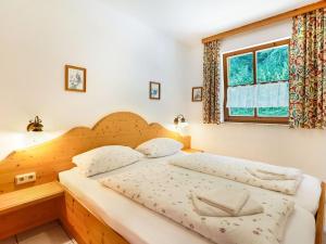 Postel nebo postele na pokoji v ubytování Ferienwohnung am Felsennest Berchtesgadener Land