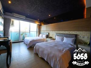 Postel nebo postele na pokoji v ubytování R8 Eco Hotel