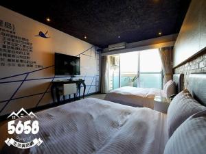 Postel nebo postele na pokoji v ubytování R8 Eco Hotel