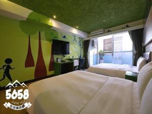 Postel nebo postele na pokoji v ubytování R8 Eco Hotel