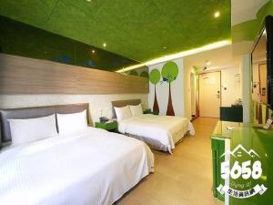 Postel nebo postele na pokoji v ubytování R8 Eco Hotel