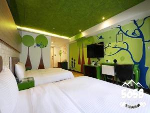 Postel nebo postele na pokoji v ubytování R8 Eco Hotel
