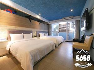 Postel nebo postele na pokoji v ubytování R8 Eco Hotel