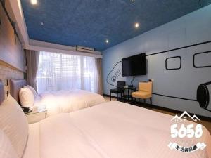 Postel nebo postele na pokoji v ubytování R8 Eco Hotel